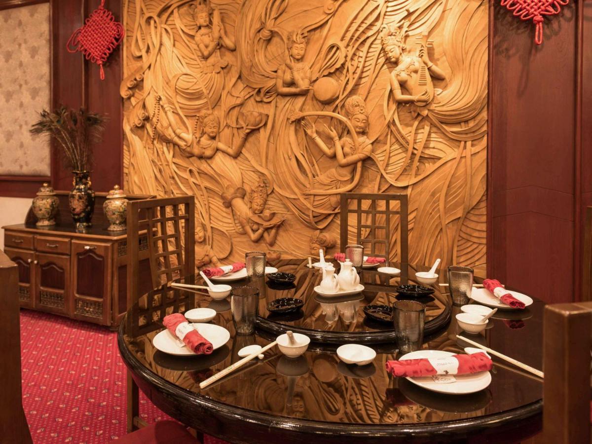 Hotel Mercure Alger Aeroport Maison Blanche Exterior photo A table set for dim sum